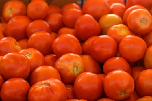 beautiful fresh tomatoes in a pile at a local market in the mediterranean