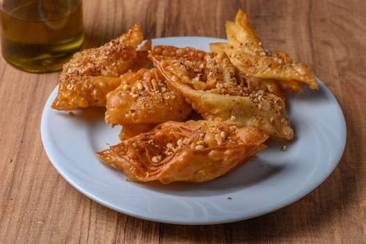 Turkish baklava, sweet dessert with honey on a light plate 4