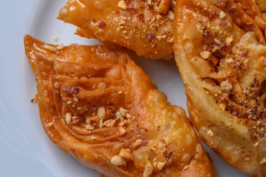 Turkish baklava, sweet dessert with honey on a light plate 7