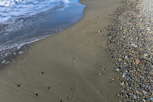 footprints of a woman on the beach of the Mediterranean Sea 2