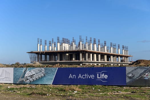 machine for pouring concrete at the construction site of a new complex near the sea 4