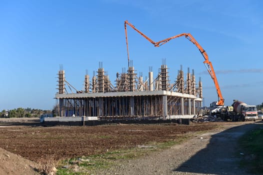 machine for pouring concrete at the construction site of a new complex near the sea 1