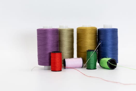 A vibrant assortment of colorful spools and threads, showcasing a diverse range of hues