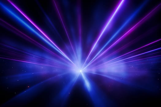 Blue and violet beams of bright laser light shining on black background. High quality photo