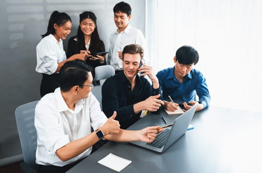 Group of diverse office worker employee working together on strategic business marketing planning in corporate office room. Positive teamwork in business workplace concept. Prudent