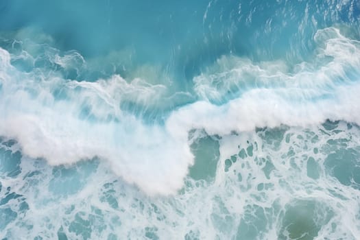 From above aerial view of turquoise ocean water with splashes and foam for abstract natural background and texture. High quality photo