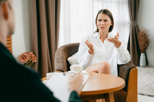 Psychological consultation gaining improvement on mental problem, happy young female patient doing therapy session while psychiatrist making diagnostic on mental illness. Unveiling