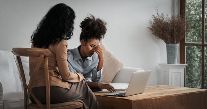 Sad PTSD woman patient in crucial therapy for mental health with psychologist, depression or grief after life failure. Frustrated trauma young woman talking to a psychologist about emotion in clinic