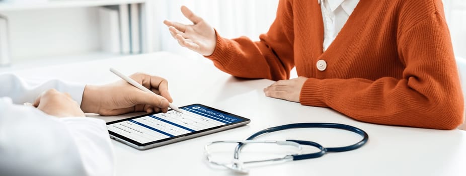 Patient attend doctor's appointment at clinic or hospital office, discussing medical treatment options and explaining examination results or medical record about sickness. Panorama Rigid