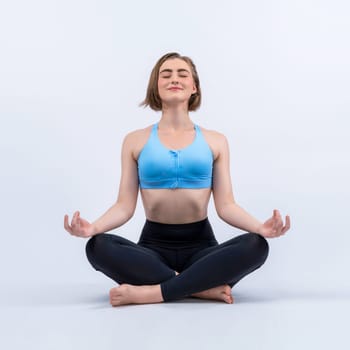 Full body length gaiety shot athletic and sporty woman doing healthy and meditative yoga exercise workout posture on isolated background. Healthy active and body care lifestyle