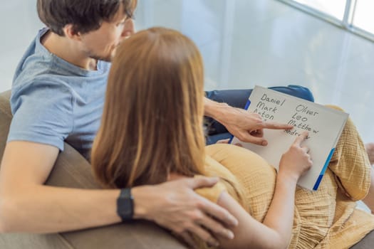 Expectant couple joyfully selects a name for their unborn son, savoring the special moment of choosing a meaningful identity for their growing family.