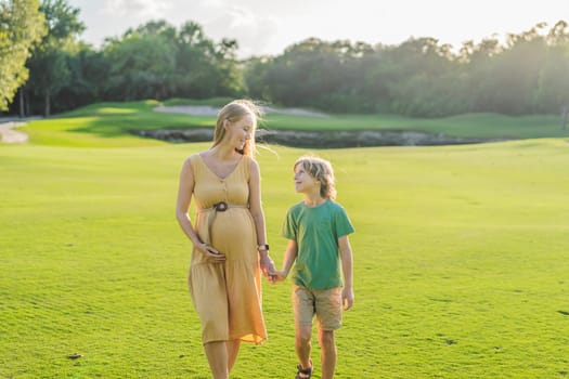 Heartwarming outdoor bonding as a pregnant mom and her son enjoy quality time together, savoring the beauty of nature and creating cherished moments.