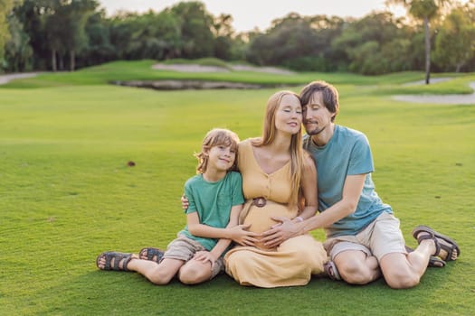 Joyful family time as a pregnant woman, her husband, and son share quality moments outdoors, embracing the beauty of nature and creating cherished memories together.