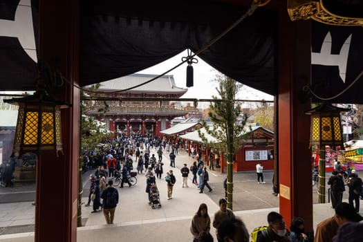 Tokyo, Japan. January 2024. the faithful at the Sensō-ji Buddhist temple main hall in the city center