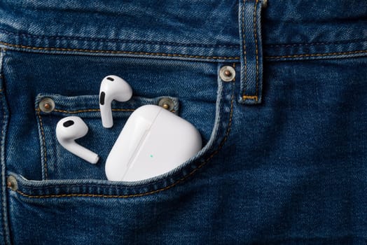 Antalya, Turkey - January 15, 2024: White wireless headphones Apple AirPods 3