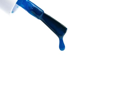 Brush with blue nail polish and drop, isolate on white background
