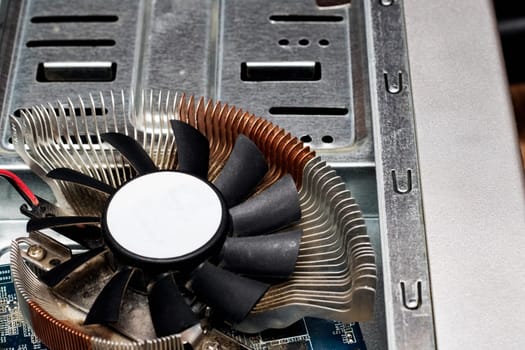 Video card fan close up on the background of a computer