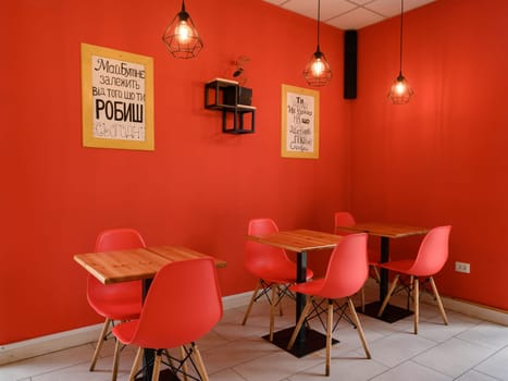 Ivano-Frankivsk, Ukraine March 26, 2023: Interior of a fast food establishment or cafe, red interior in a cafe.