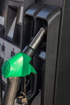 Refueling pistols at a gas station close up, copy space