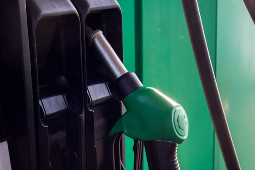 Refueling pistols at a gas station close up, copy space