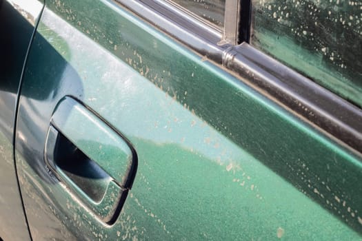 Close up green dirty car door handle with copy space