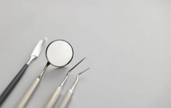 Dental instruments for work lie on table. Dentist services concept