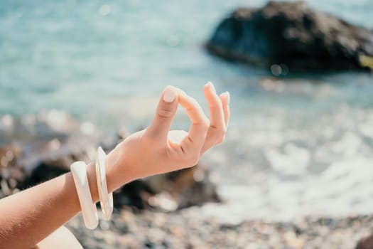 Close up Hand Gesture of Woman Doing an Outdoor Lotus Yoga Position. Close up. Blurred background