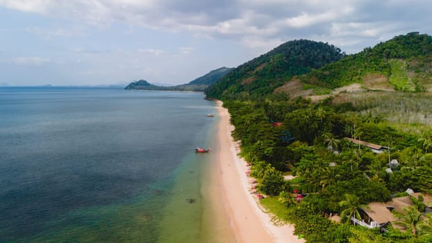 calm beach with crystal clear water on the blue sky at Koh Libong, Trang province, Thailand, Andaman Sea.