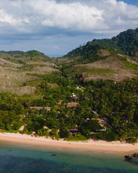 A beautiful view of a calm beach with crystal clear water on the blue sky at Koh Libong, Trang province, ThailandmAndaman Sea in the afternoon light