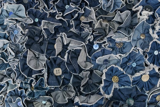 Denim blue jeans pieces with buttons Background texture