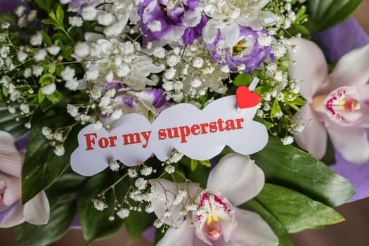 cardboard card with flowers and text for my superstar..greeting card with white flowers bouquet .Postcard with fresh flowers and letter for you.