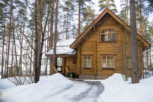 Winter's Tale. Red Finnish cottage in a beautiful snow forest.