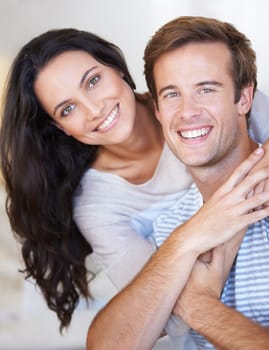 Portrait, couple hug and love with care, marriage and happiness at home, healthy relationship and trust. People bonding, loyalty and connection with smile, partner and romance together at house.