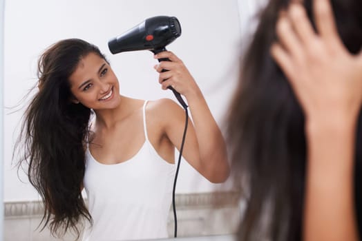 Blow dry, home and woman with hair care, happy and mirror with treatment, grooming and routine. Person, smile and girl with salon equipment, texture and volume with shine, glowing and wellness.