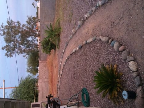 Path Lined with River Rocks in Arizona Backyard. High quality photo