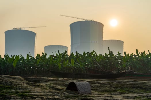 Cooling towers of a nuclear power plant at dawn. Ruppur, Bangladesh