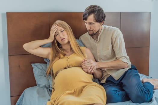 Expectant woman feels unwell, husband comforts and reassures her during a challenging pregnancy.