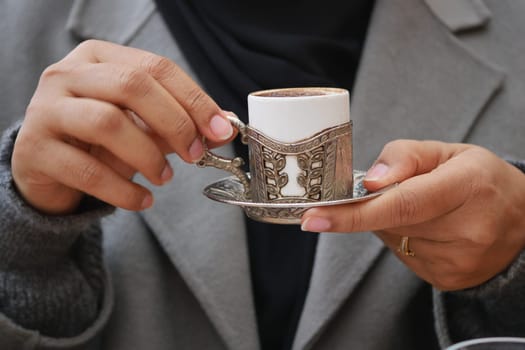 a cup of turkish coffee on table .