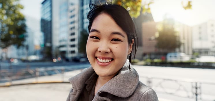 Business, city and portrait of Japanese happy woman for morning commute, travel and walking. Professional, corporate and worker with ambition, pride and confident for career, work and job in Tokyo.