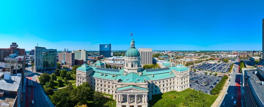 Aerial panoramic view of classic Capitol building amidst modern cityscape in Indianapolis, captured by DJI Mavic 3 drone, showcasing the marriage of history and urban development.