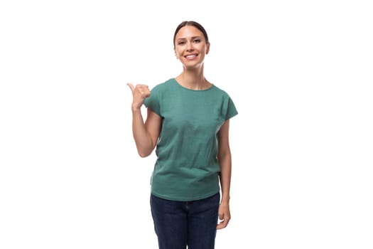 young slender woman dressed in a green basic straight cut t-shirt with space for branding print.