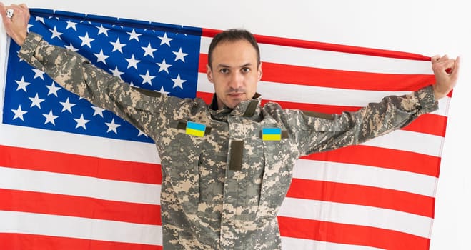 Ukrainian military man with USA flag.