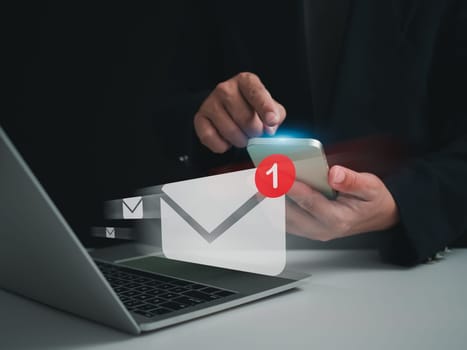 Businessman checking email on the phone screen. New email notification concept for business email communication and digital marketing. Inbox receives notification of electronic messages. Internet technology.