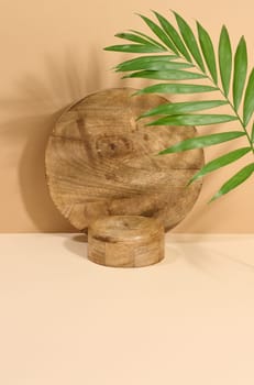 Round brown wooden stand on a beige background, a place to display cosmetics and products