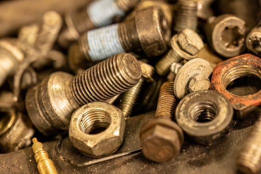 Photo highlighting old screws, symbolizing the enduring nature of mechanical repairs and maintenance.