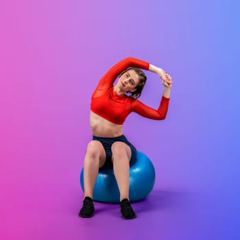 Full body length gaiety shot athletic and sporty young woman with fitness exercising ball in standing posture on isolated background. Healthy active and body care lifestyle.