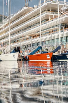 Monaco, Monte-Carlo, 25 October 2022: teams is waiting race, port Hercules, bows of boat with sails, a lot of sail boats are moored in the new Yacht Club at sunny day, no wind,. High quality 4k footage