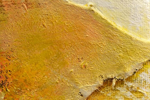 The bright texture of the canvas, painted in orange-yellow-brown colors with shades. Abstract background