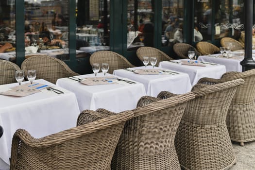 Traditional Parisian cafe with wicker chairs France