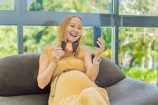 Excited woman shares the joy of motherhood, displaying an ultrasound photo of her child via a heartwarming video cal.